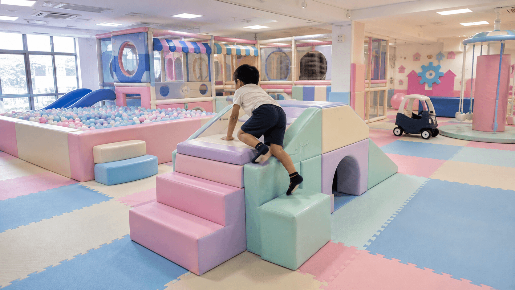 Indoor soft play area with padded foam shapes at Neobee Preschool in Panchlaish